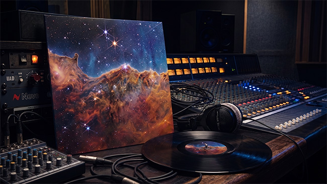 A custom vinyl and its sleeve on a mixing desk